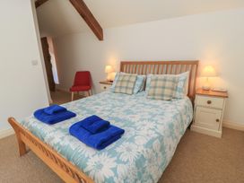 A bedroom with a bed and bedside table at Dale Barton in Wells