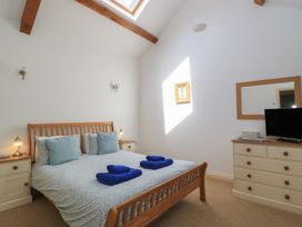 A bedroom with a bed and television at Dale Barton in Wells