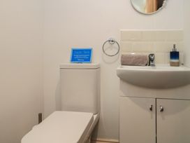 A bathroom with a toilet and sink at Dale Barton in Wells