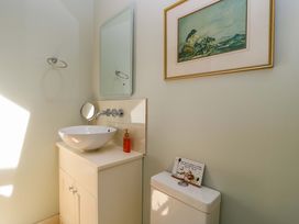 A bathroom with a sink and toilet at Pheasant Cottage in Priston Village, BATH