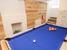 A pool table with billiard balls arranged at Labour in Vain in St Ives