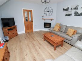 A living room with a sofa and coffee table at Hasting Dairy near North Sunderland