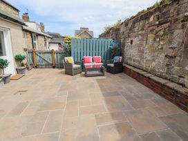 An outdoor seating area with furniture at Hasting Dairy North Sunderland near Seahouses