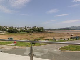 A view of houses and boats near the water at Bay View Apartment in Porthmadog