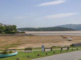 A view of boats on a sandy shore at Bay View Apartment in Porthmadog