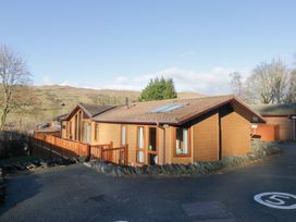 A house with windows and a fence at Heights View in 