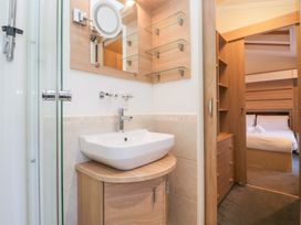 A bathroom with a sink and mirror at Heights View