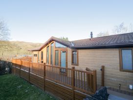 An exterior view of a cabin with a deck at Heights View 