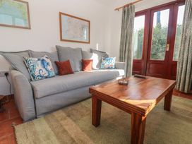 A living room with a sofa and coffee table at Kernyk in Penzance