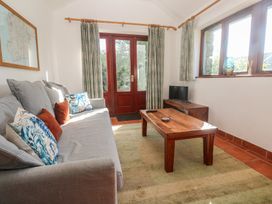 A living room with a sofa and coffee table at Kernyk in Penzance