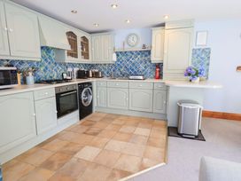A kitchen with appliances and counters at Lakeside Cottage Ecclerigg near Ambleside