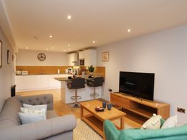 A living room with a sofa, coffee table, and television at Premier, Transit & Lady Hilda @ Engine Shed, Whitby