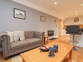 A living room with a sofa and coffee table at Premier, Transit & Lady Hilda @ Engine Shed, Whitby