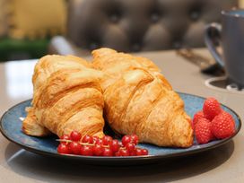A plate with two croissants and berries at Premier, Transit & Lady Hilda @ Engine Shed, Whitby