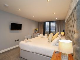 A bedroom with a bed and television at Premier, Transit & Lady Hilda @ Engine Shed, Whitby