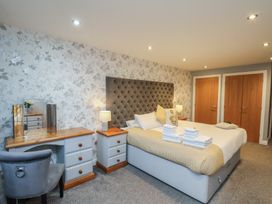A bedroom with a bed and nightstand at Premier, Transit & Lady Hilda @ Engine Shed, Whitby
