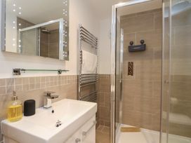 A bathroom featuring a sink, shower, and towel rail at Premier, Transit & Lady Hilda @ Engine Shed, Whitby