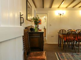 A dining room with a table and chairs at Ael Y Bryn Menai Bridge