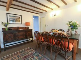 A dining room with a table and chairs at Ael Y Bryn Menai Bridge