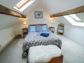 A bedroom with a bed and skylights at Ael Y Bryn in Menai Bridge