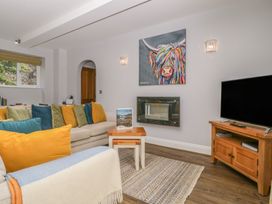 A living room with a television and coffee table at High Spy in Keswick