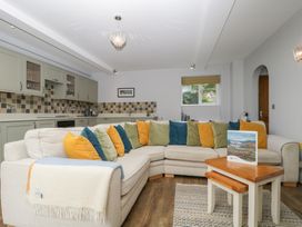 A living room with a sofa and coffee table at High Spy in Keswick