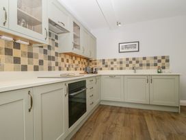 A kitchen with cabinets and appliances at High Spy in Keswick