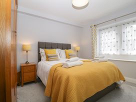 A bedroom with a double bed and bedside table at High Spy in Keswick