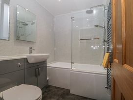 A bathroom with a toilet, sink, and shower at High Spy in Keswick