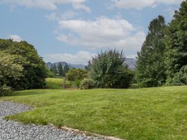 A garden with trees and a pathway at High Spy in Keswick