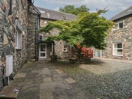 An outdoor area with stone building and a tree at High Spy in Keswick
