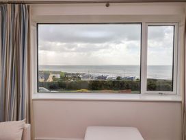 A living room window overlooking the sea at Bryn Deryn in Criccieth