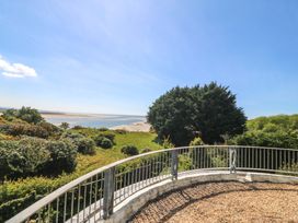 A view of the sea and beach from a balcony at Bryn Y Mor, Borth Y Gest