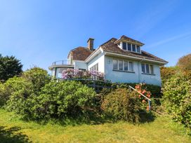A house with a balcony and garden at Bryn Y Mor, Borth Y Gest
