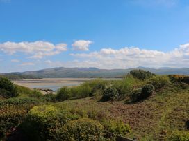 A view of mountains and water with greenery at Bryn Y Mor, Borth Y Gest