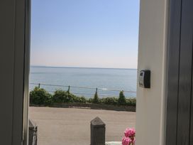 View of the sea and pathway at Captain's Rest in Criccieth