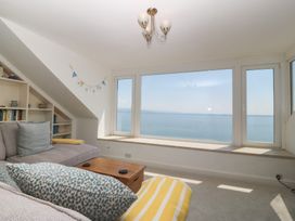 A living room with a view of the sea at Captain's Rest in Criccieth