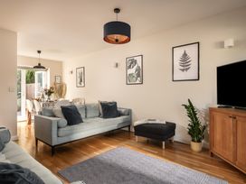 A living room with a sofa and coffee table at Coed y Felin in Conwy