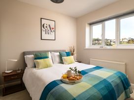 A bedroom with a bed and breakfast tray at Coed y Felin in Conwy