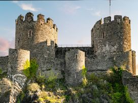 A castle with towers and stone walls in Conwy
