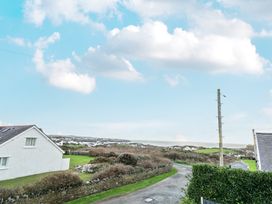 A view of the landscape with houses and a road at Curragho in Trearddur Bay