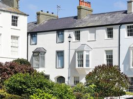 A view of houses and greenery at Tri Raglan Mawr in Beaumaris