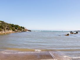 A shoreline with waves and rocks at Tyn y Mynydd in Bull Bay
