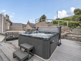An outdoor area with a hot tub and steps at Ty Mawr, Great Orme, Llandudno