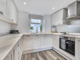 A kitchen with countertop and appliances at Ty Mawr, Great Orme Llandudno