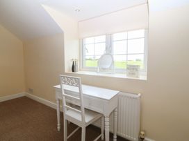 An office with a white desk and chair at Llanallgo Church Rooms