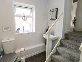 A bathroom with toilet and sink at Sea Breeze in Rhos-on-Sea