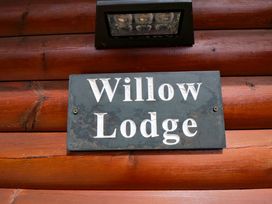 A sign that reads Willow Lodge at Ryedale Country Lodges - Willow Lodge Kirkbymoorside