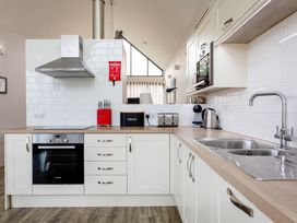 A kitchen with oven and countertop appliances at Betony in Bamburgh