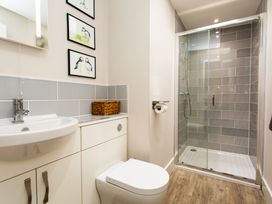 A bathroom with a shower and sink at Betony in Bamburgh
